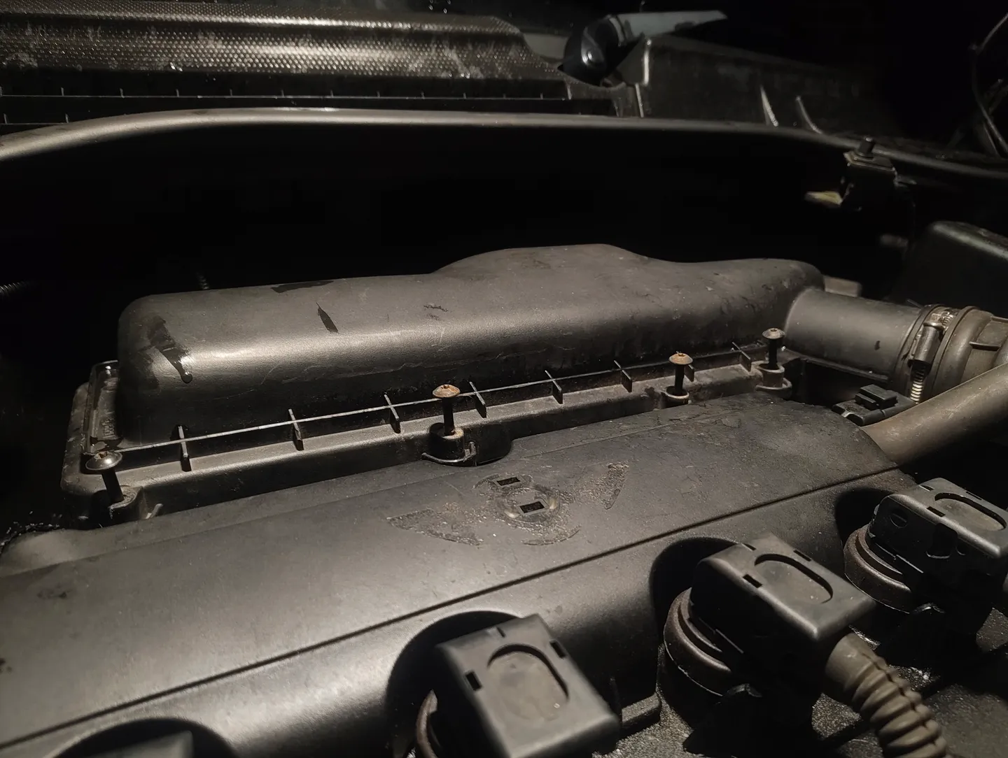 Air filter housing cover scews unscrewed