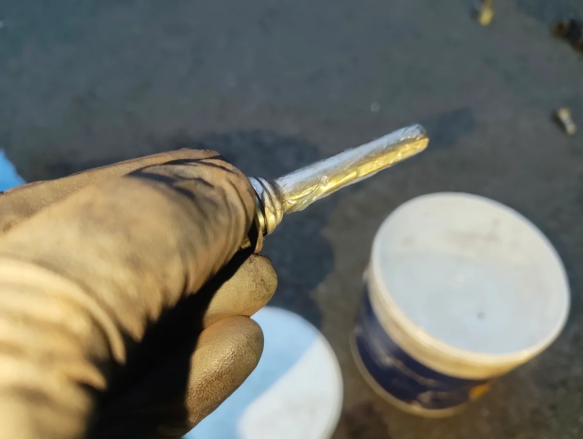 Applying silicone grease to brake caliper slider pin