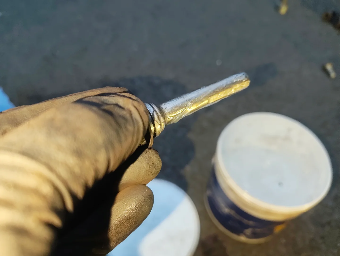 Applying silicone grease to brake caliper slider pin