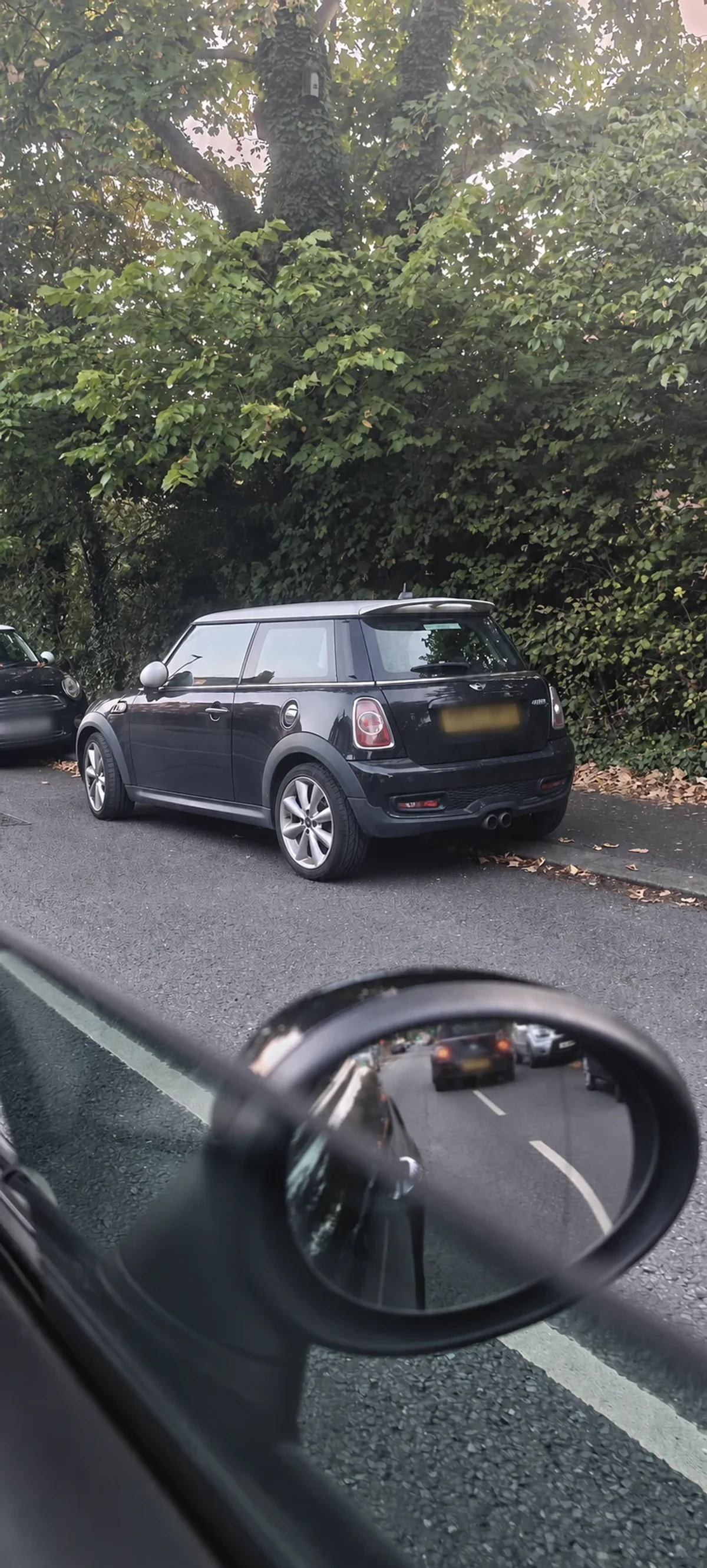 Black MINI R56 spotted from a passing car