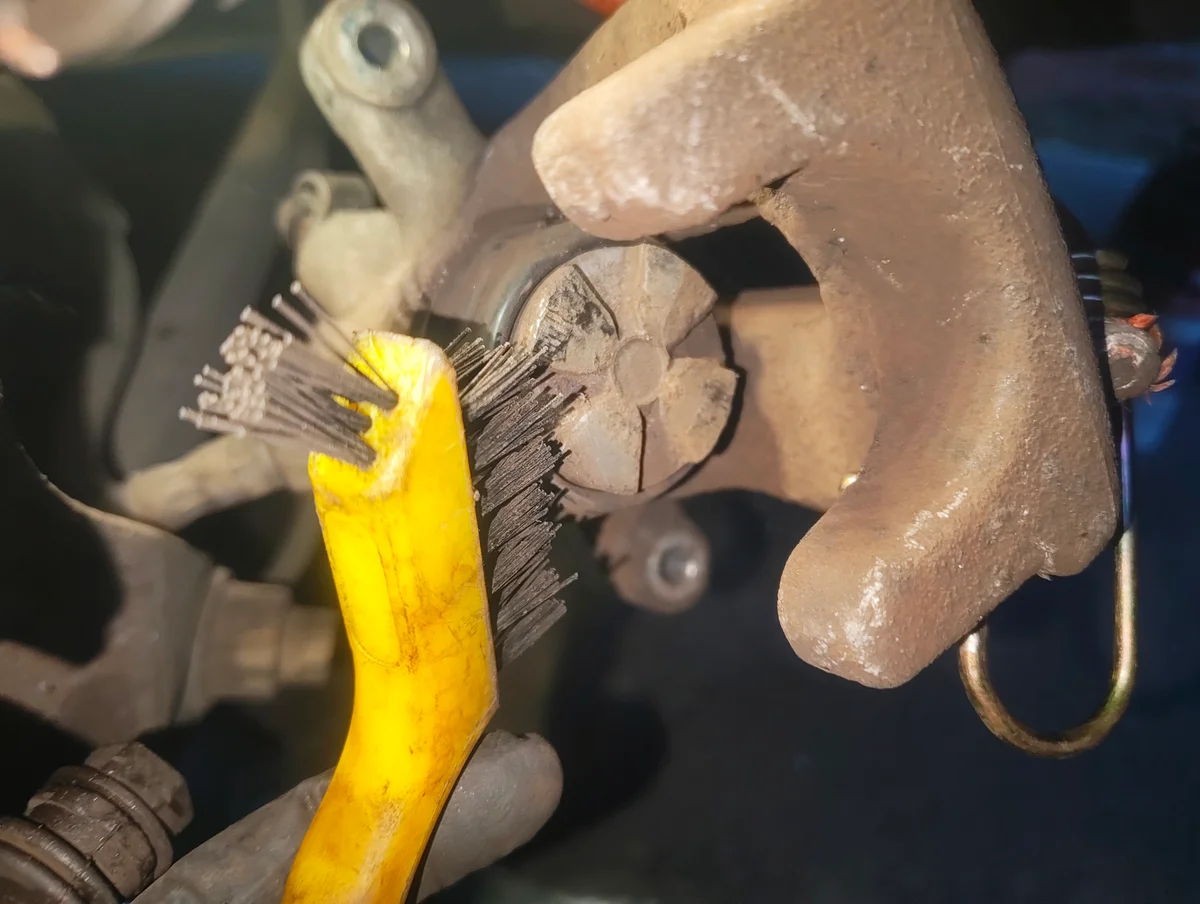 Cleaning brake caliper piston surface