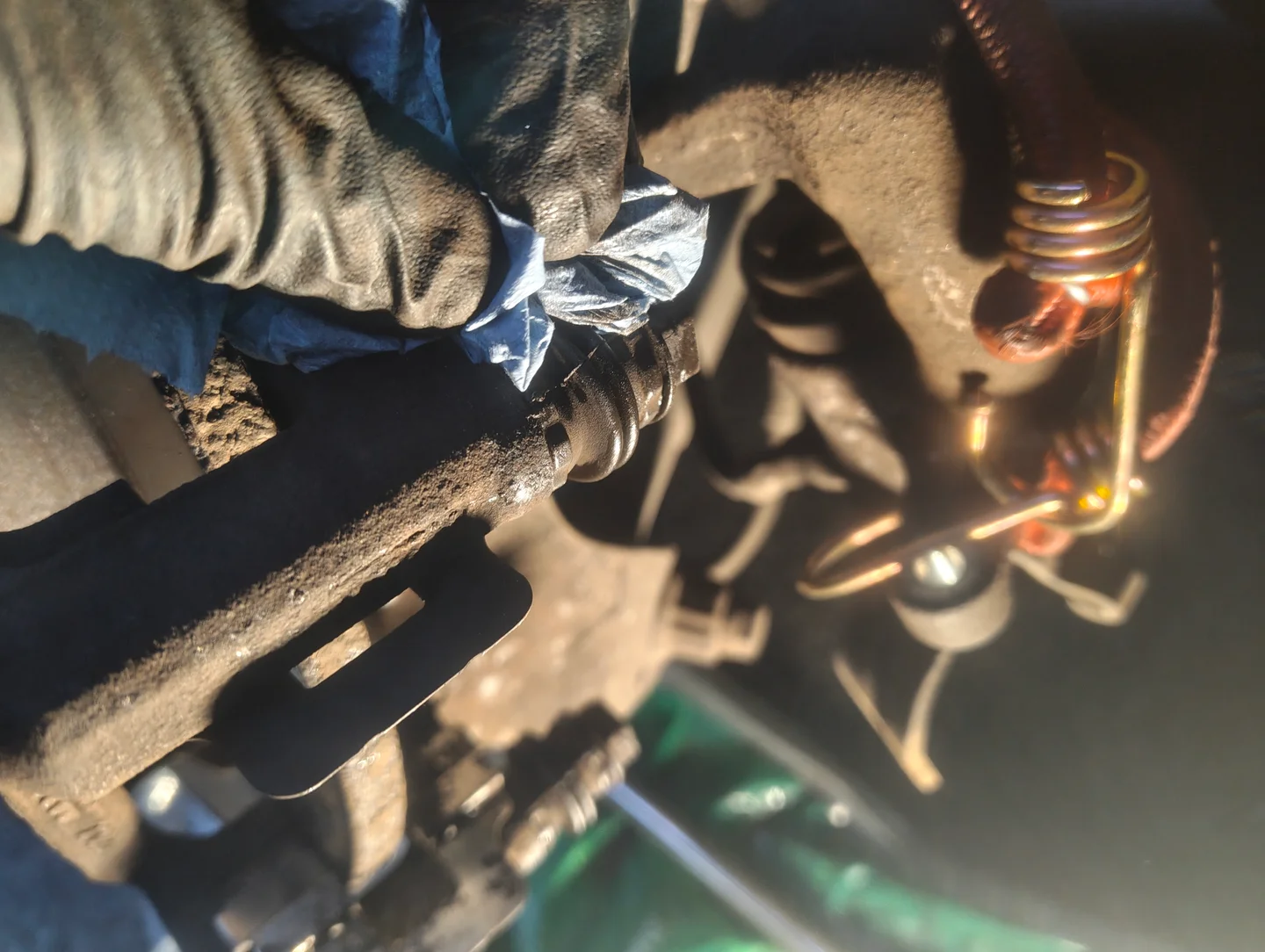 Cleaning excess silicone grease from installed slider pin boot