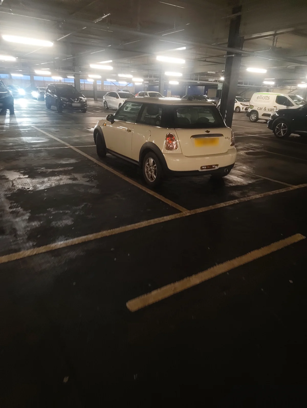 Cream MINI R56 in a multistorey car park