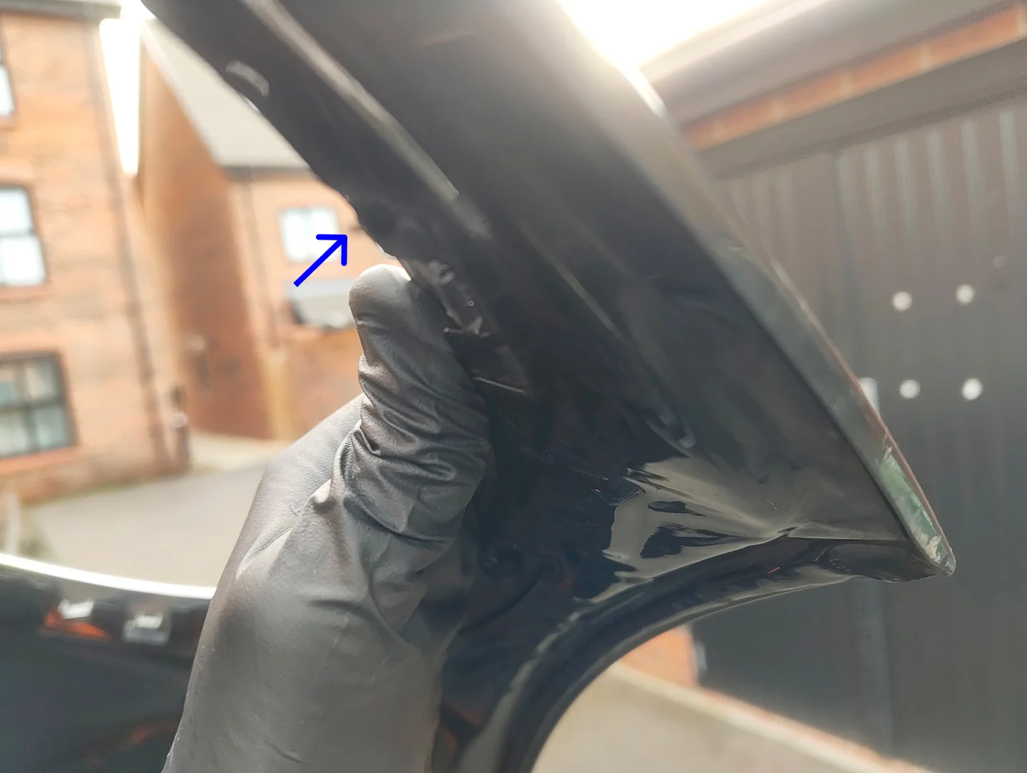 Headlight trim clip popped through