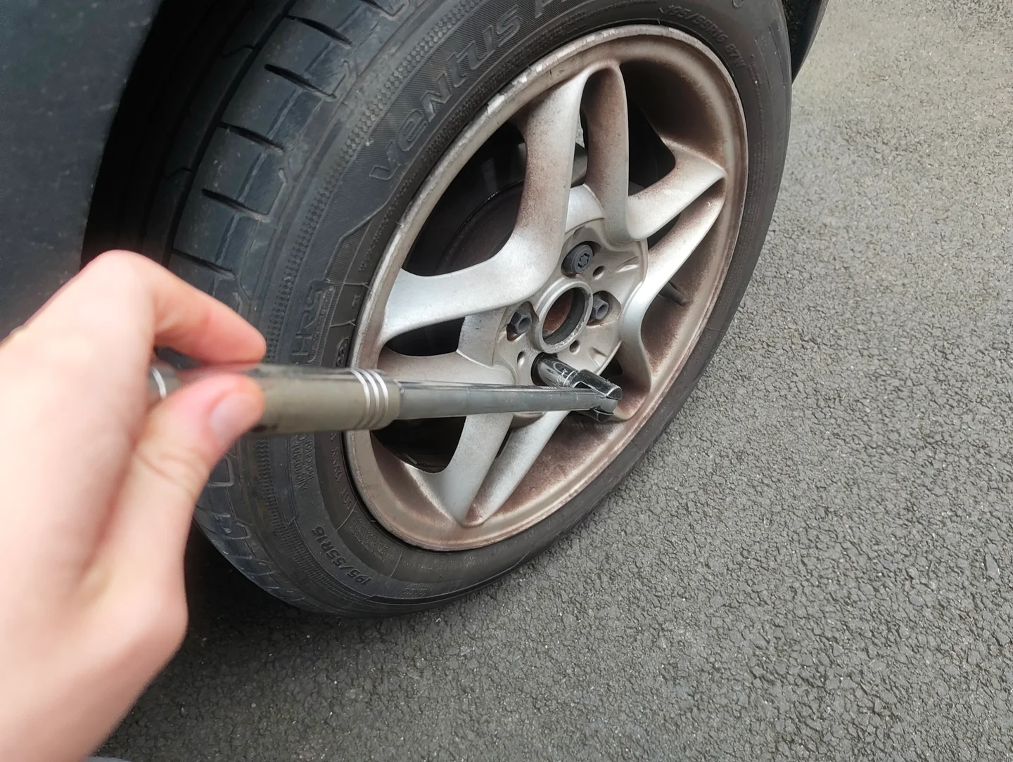 Loosening nuts on the offside rear wheel