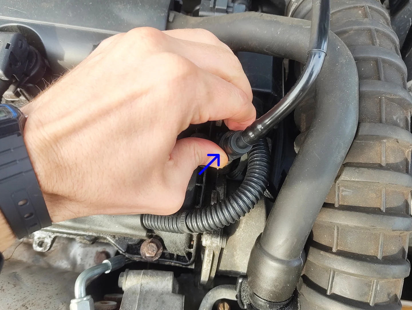 Pressing brake booster connector button