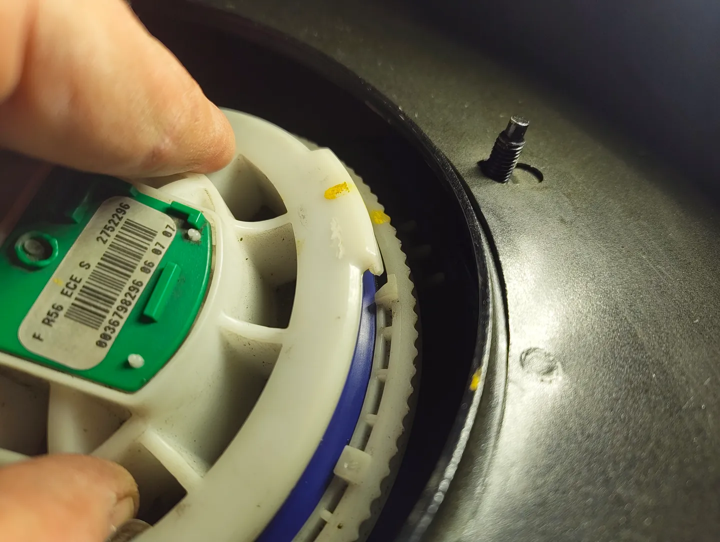 Pressing down fuel filter housing lid