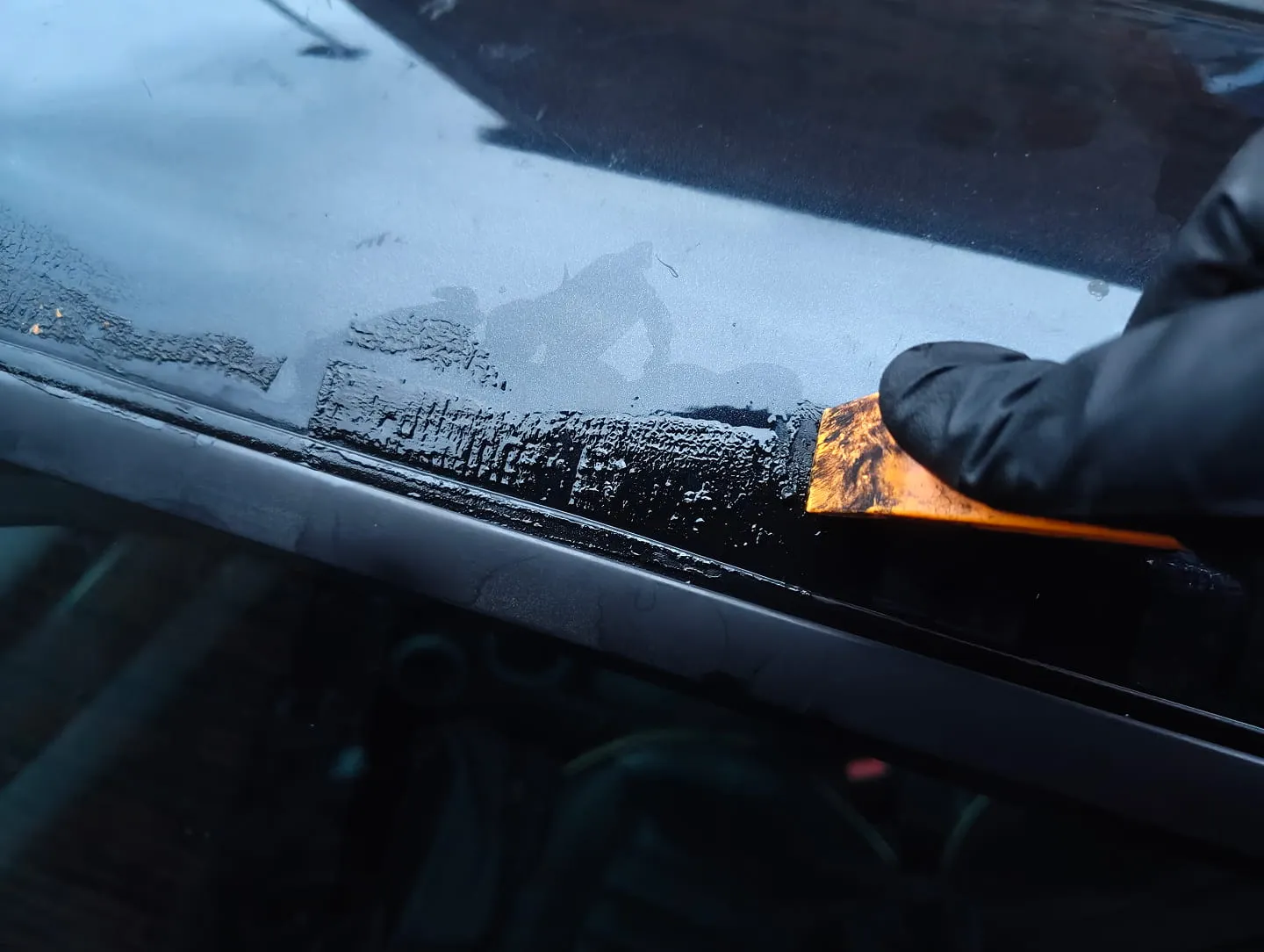 Prying adhesive with plastic pry tool