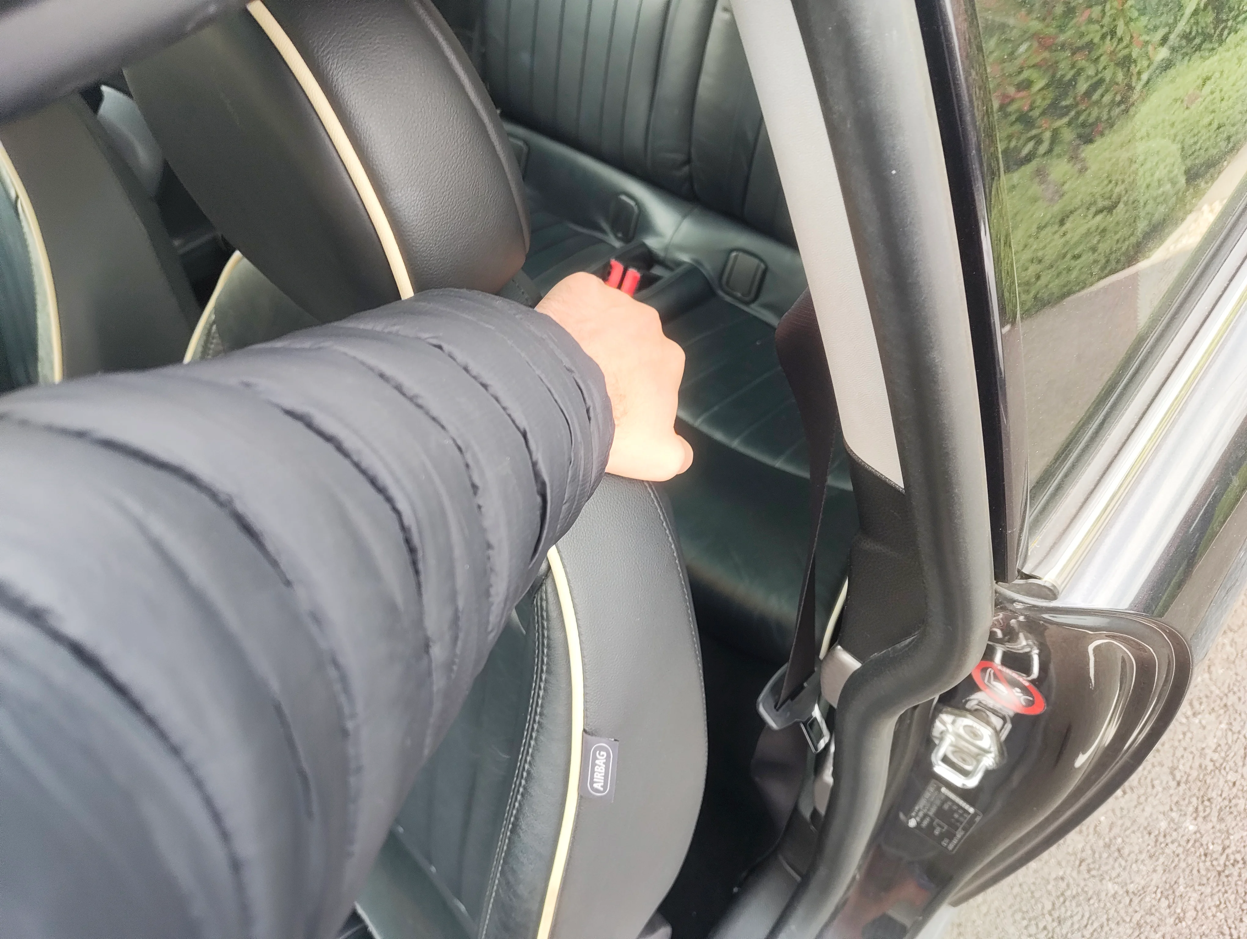 Pulling front passenger seat lever