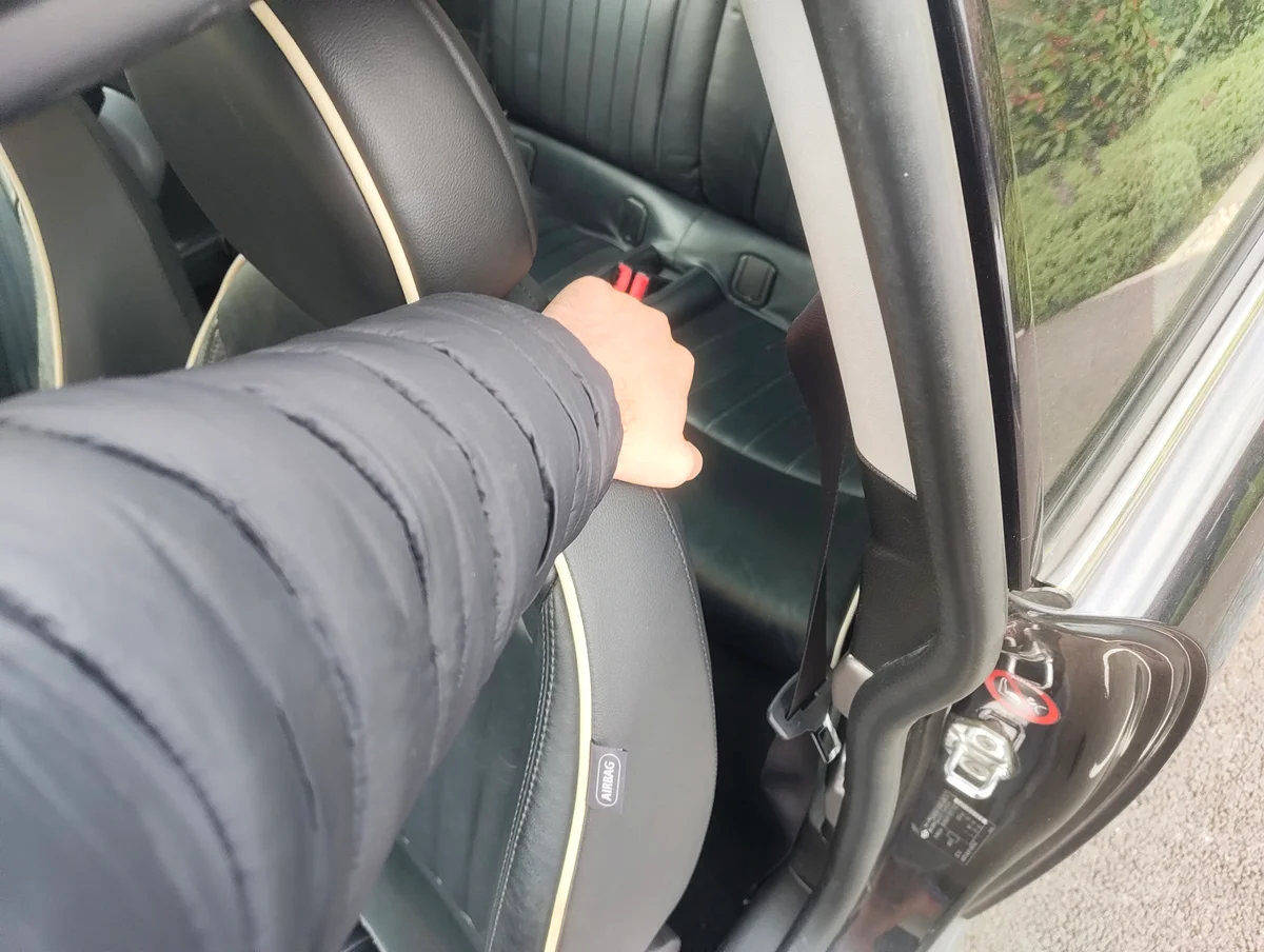 Pulling front passenger seat lever