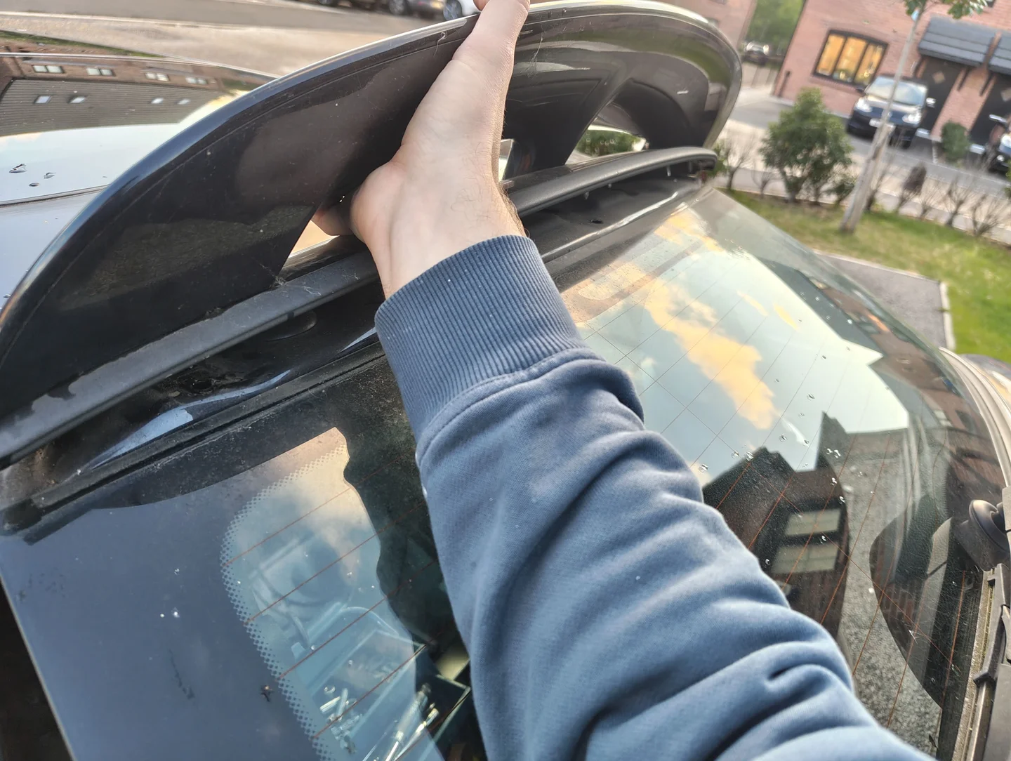 Pulling spoiler by hand to remove