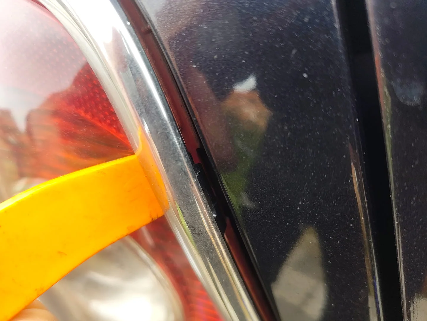 Rear light chrome trim popping off