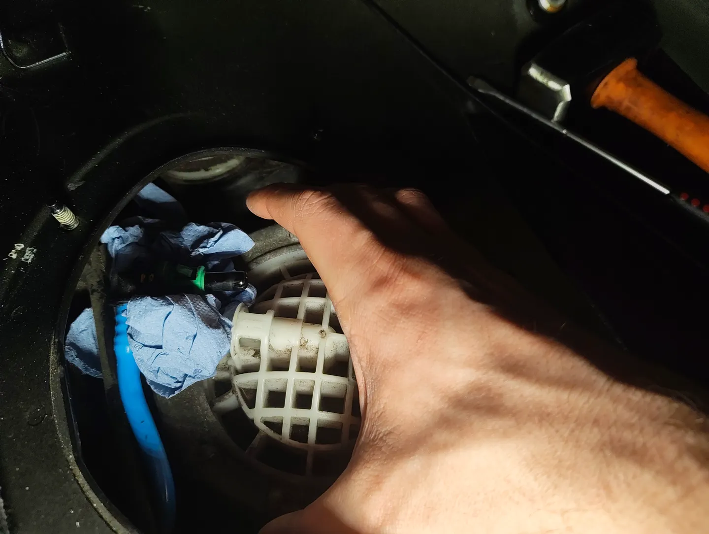 Removing fuel filter housing fastener