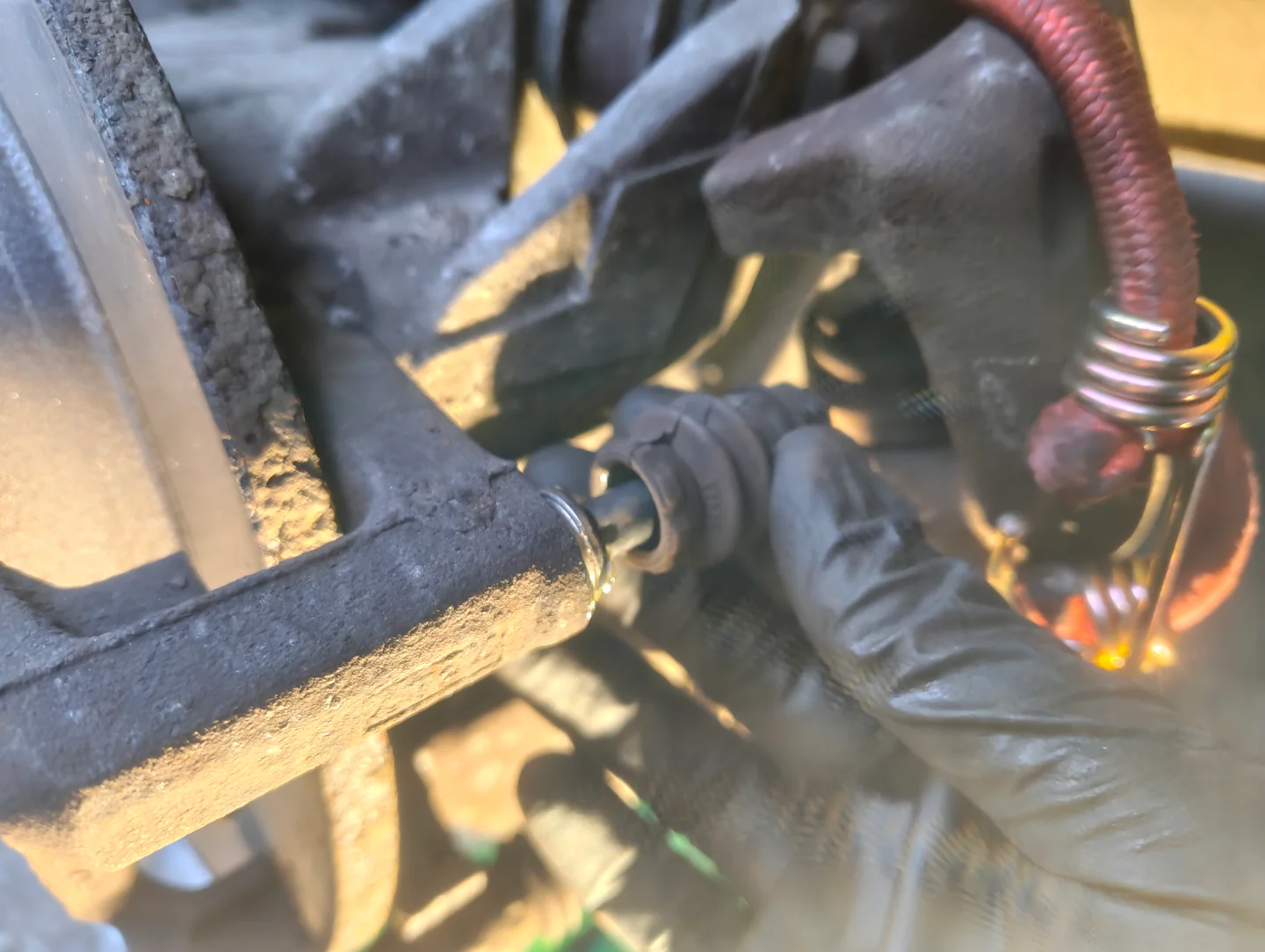 Removing rear brake caliper slider pin