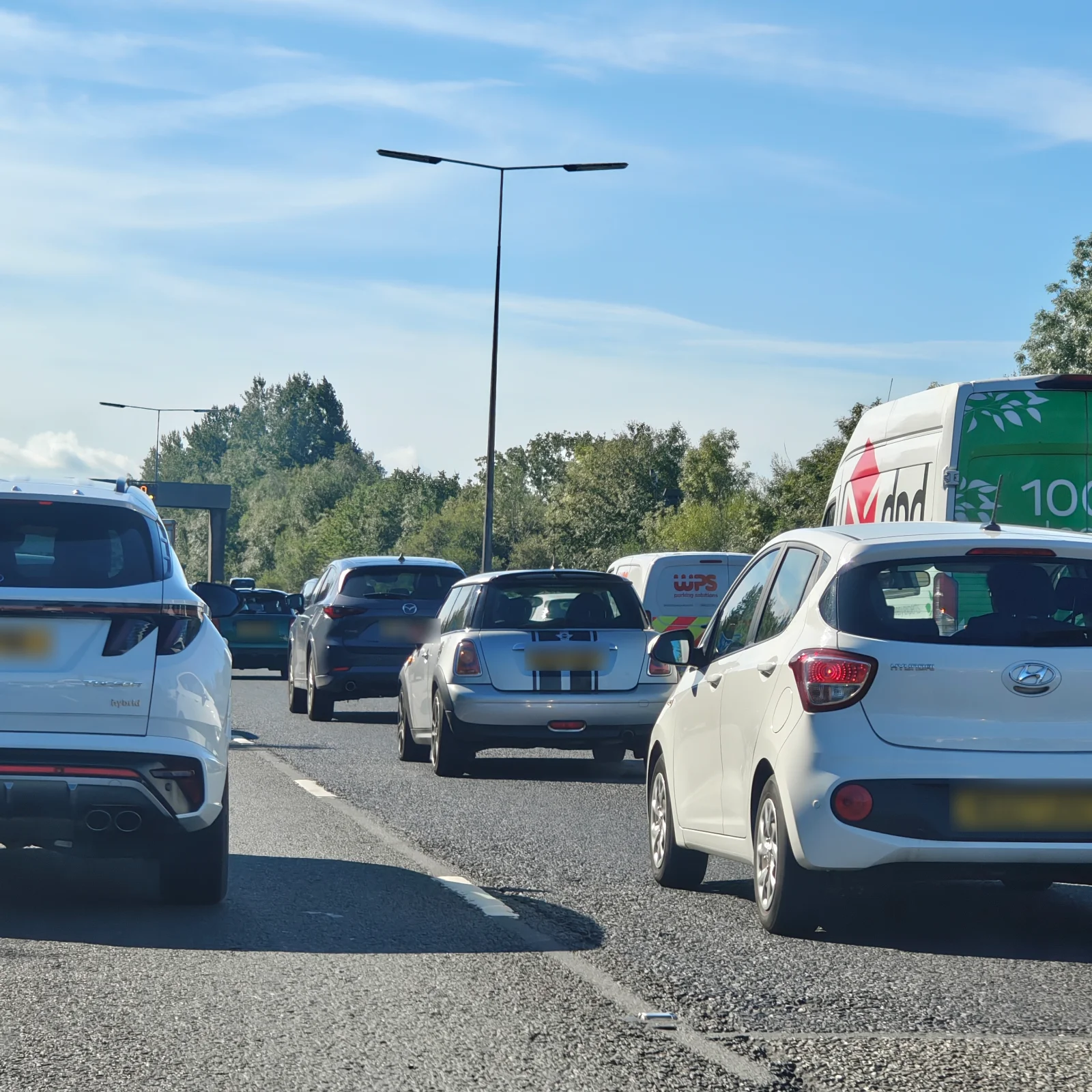 Silver MINI R56 waiting in daytime traffic