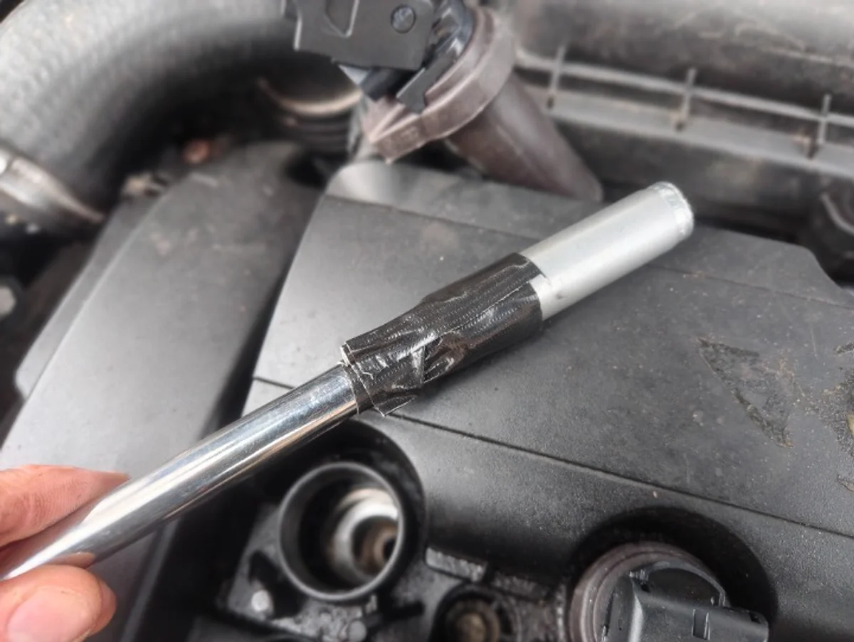 Taped up spark plug socket on extension