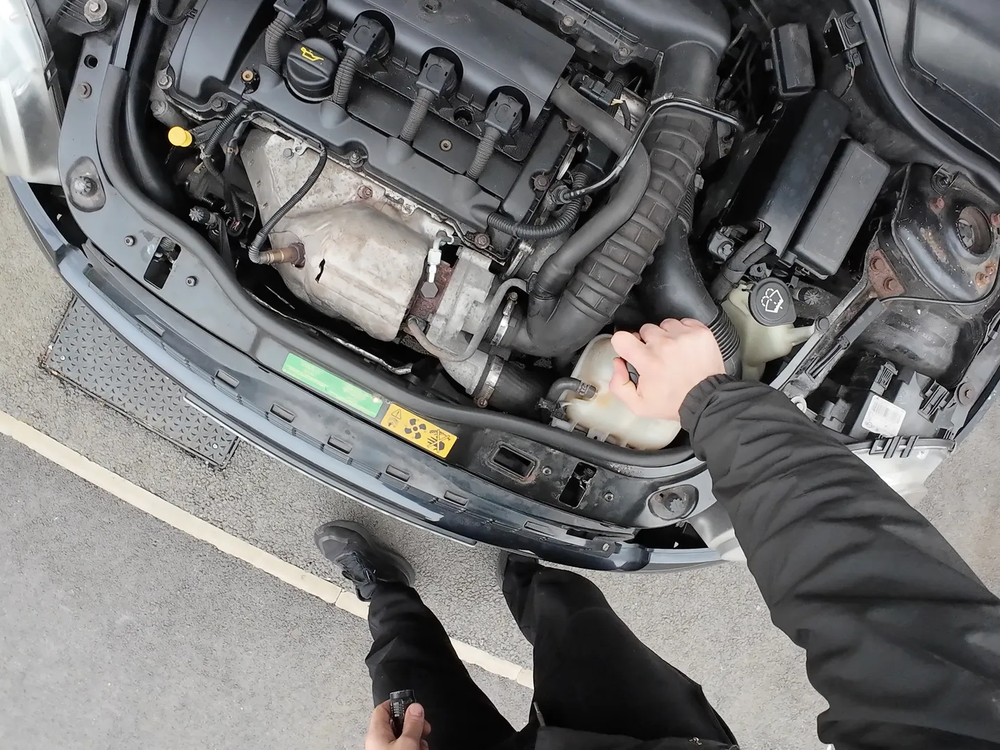 Unscrewing coolant reservoir cap