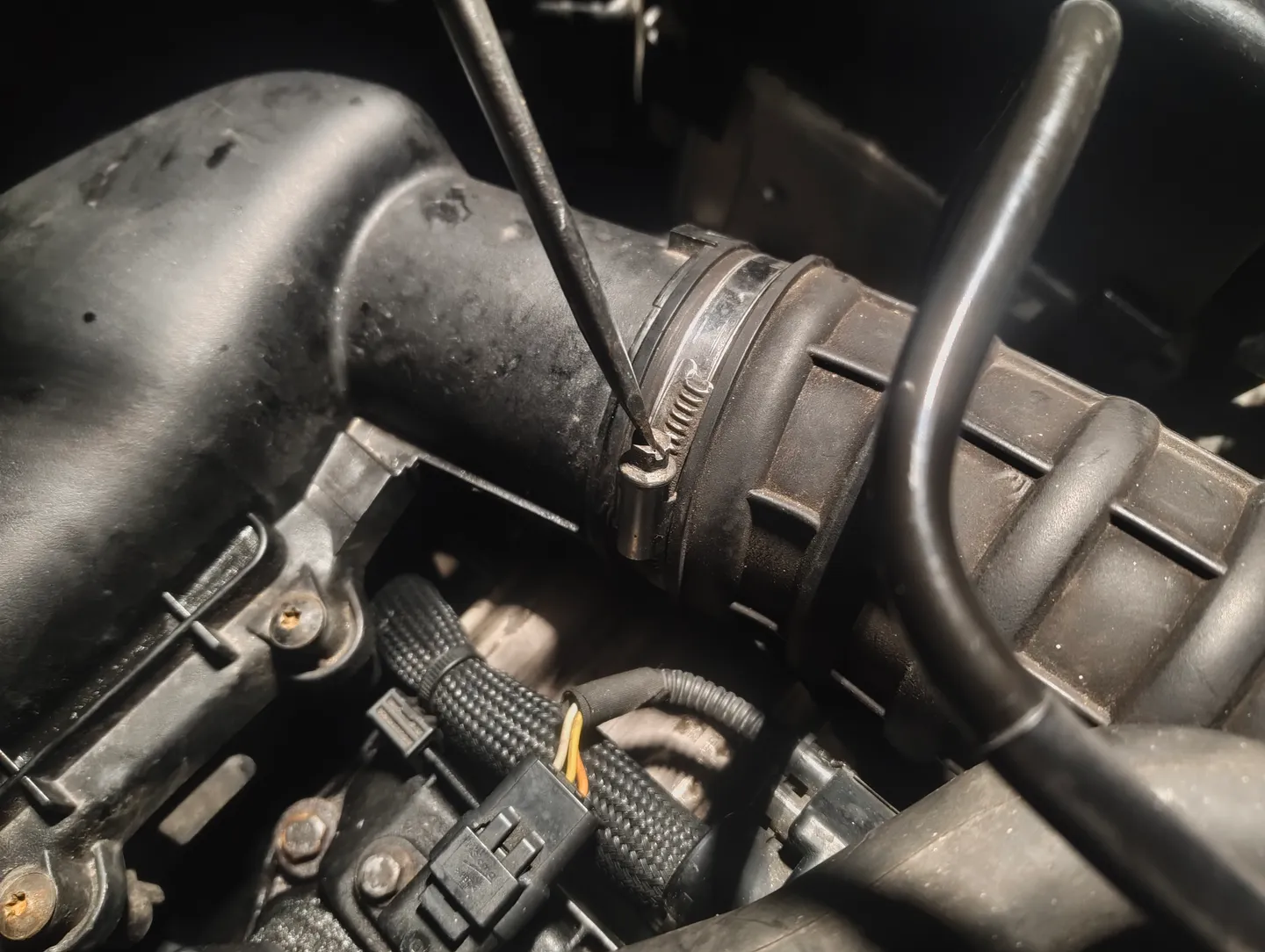 Unscrewing top of boost pipe