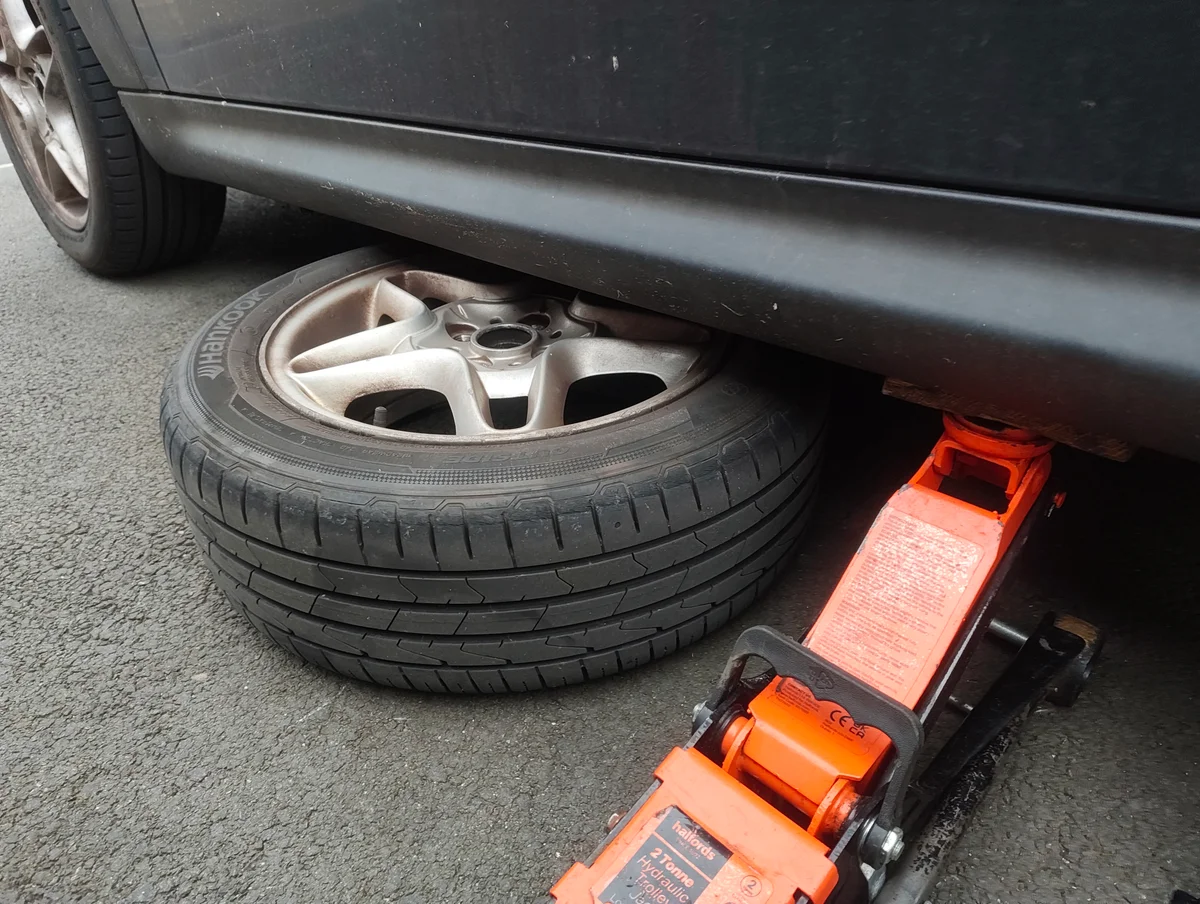Wheel under the offside pinch weld