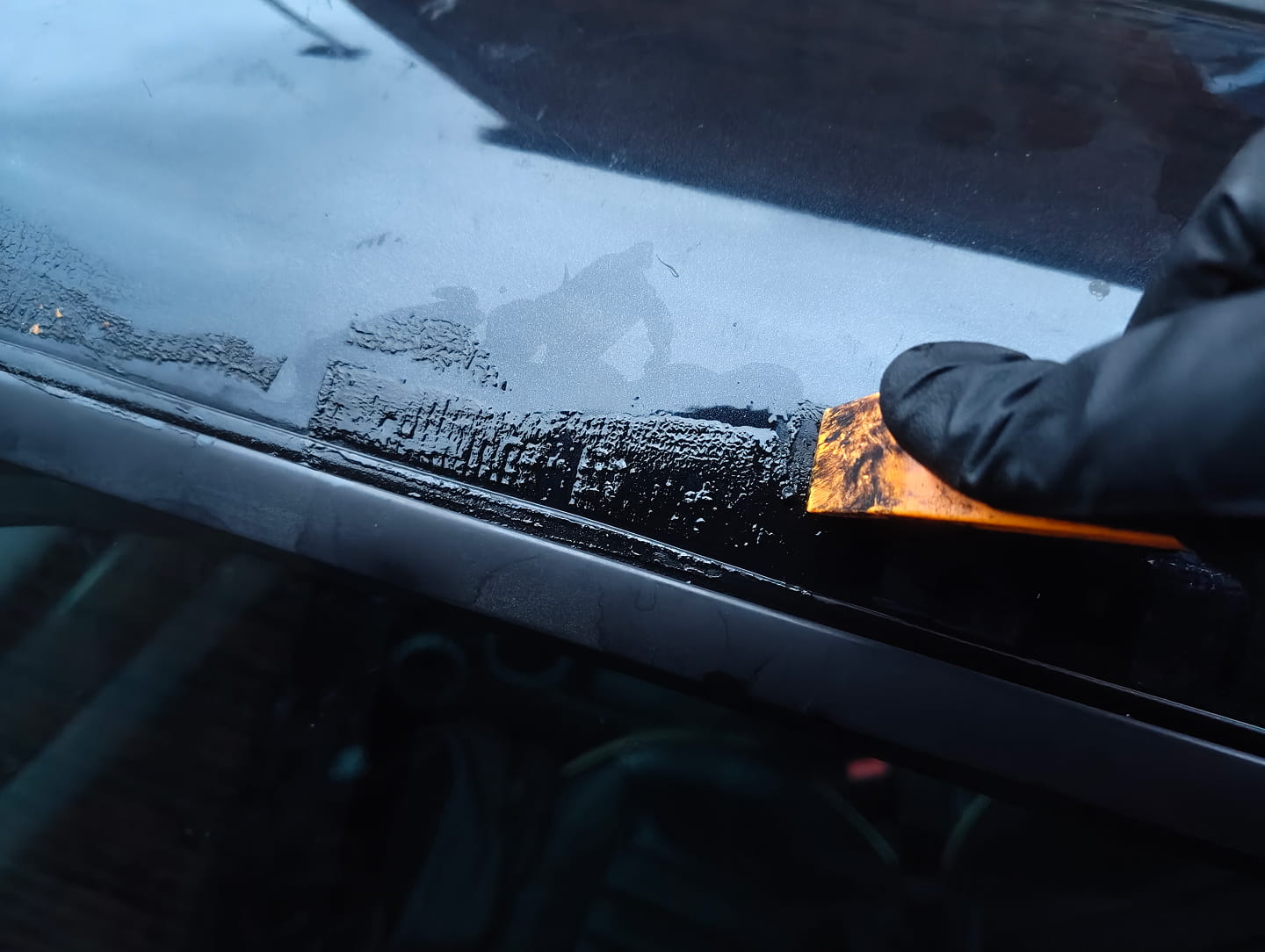 Prying adhesive with plastic pry tool