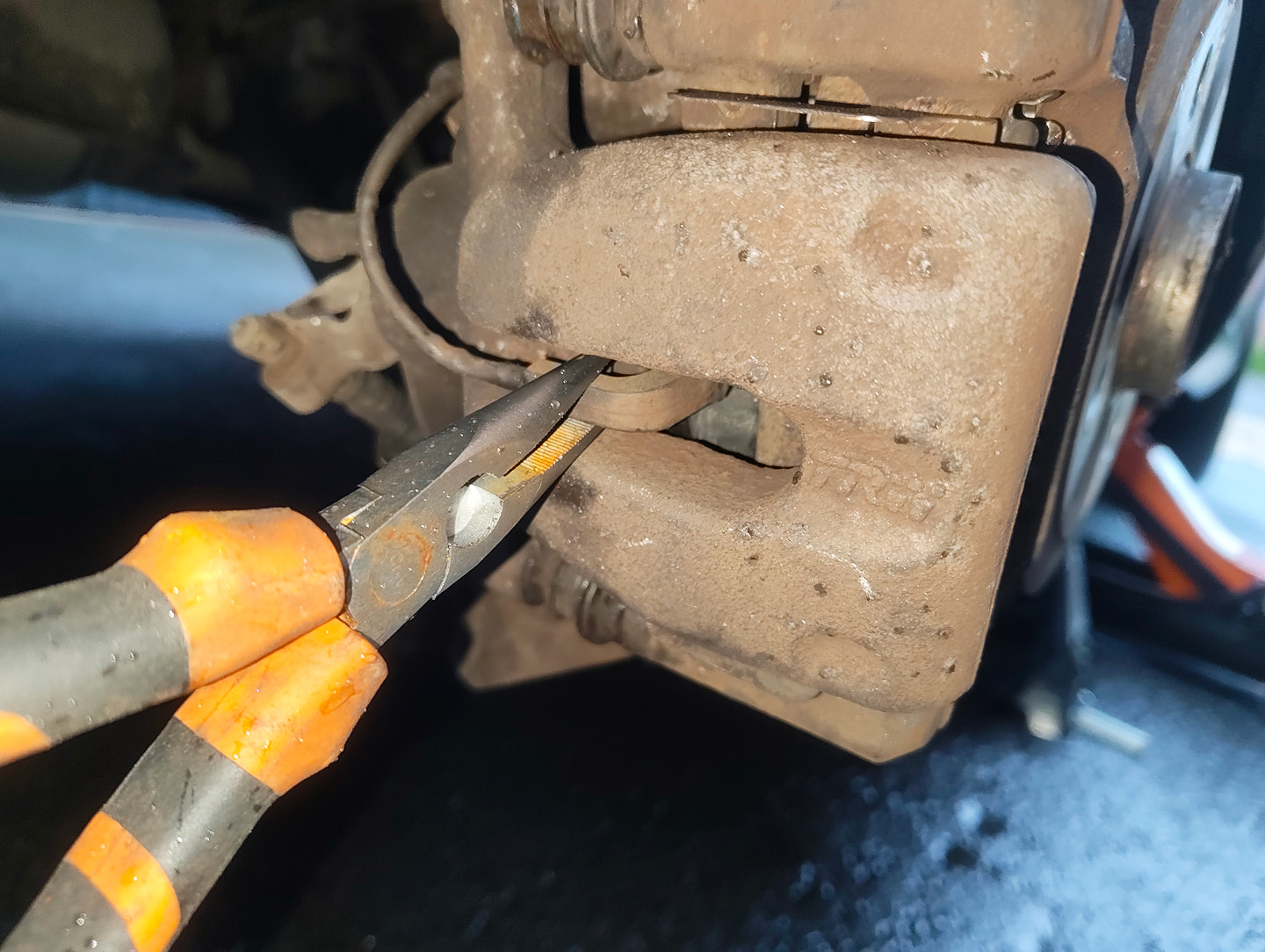 Pliers on the rear pad sensor