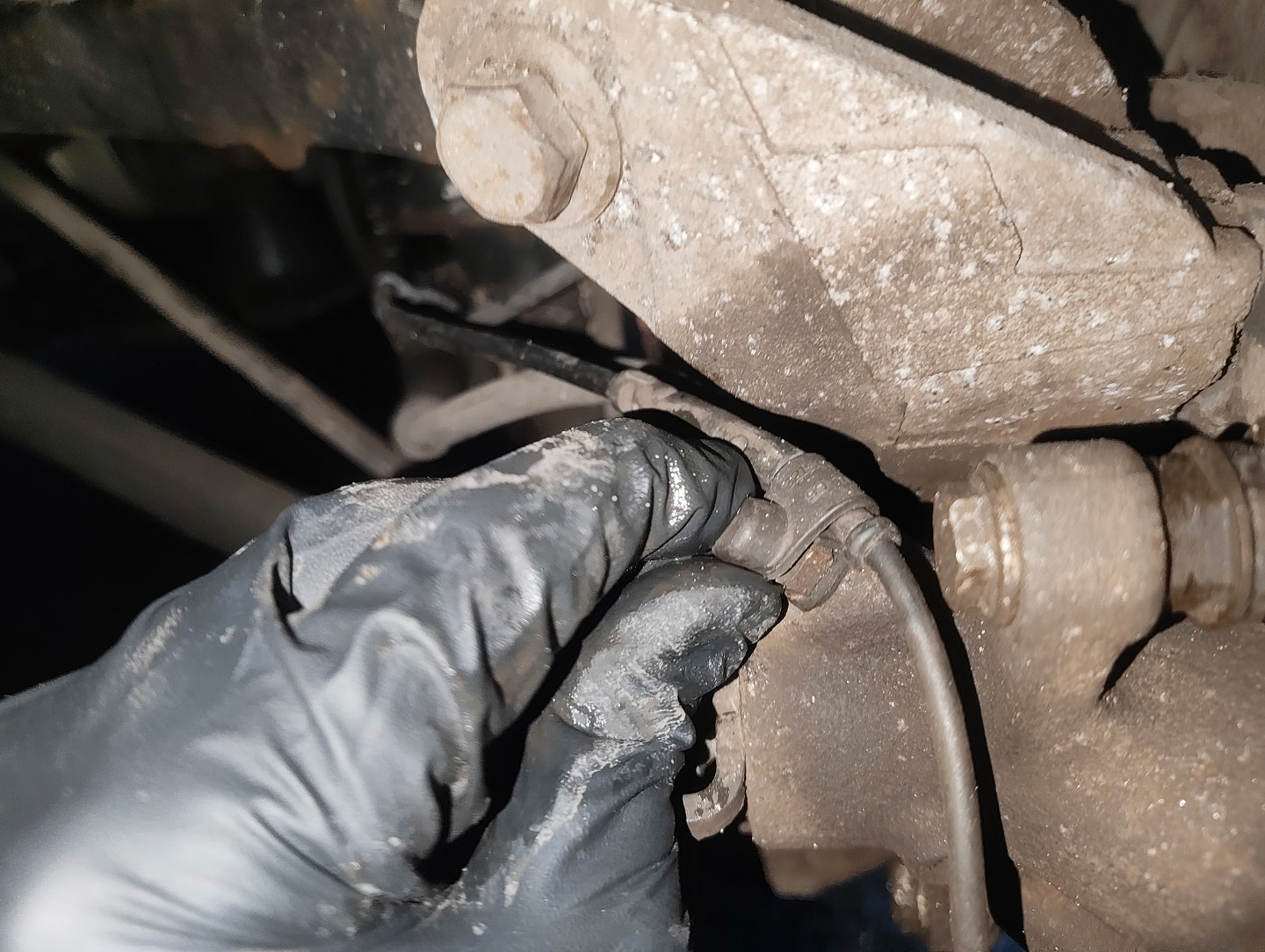 Rear brake bleed needle sensor cable fastener