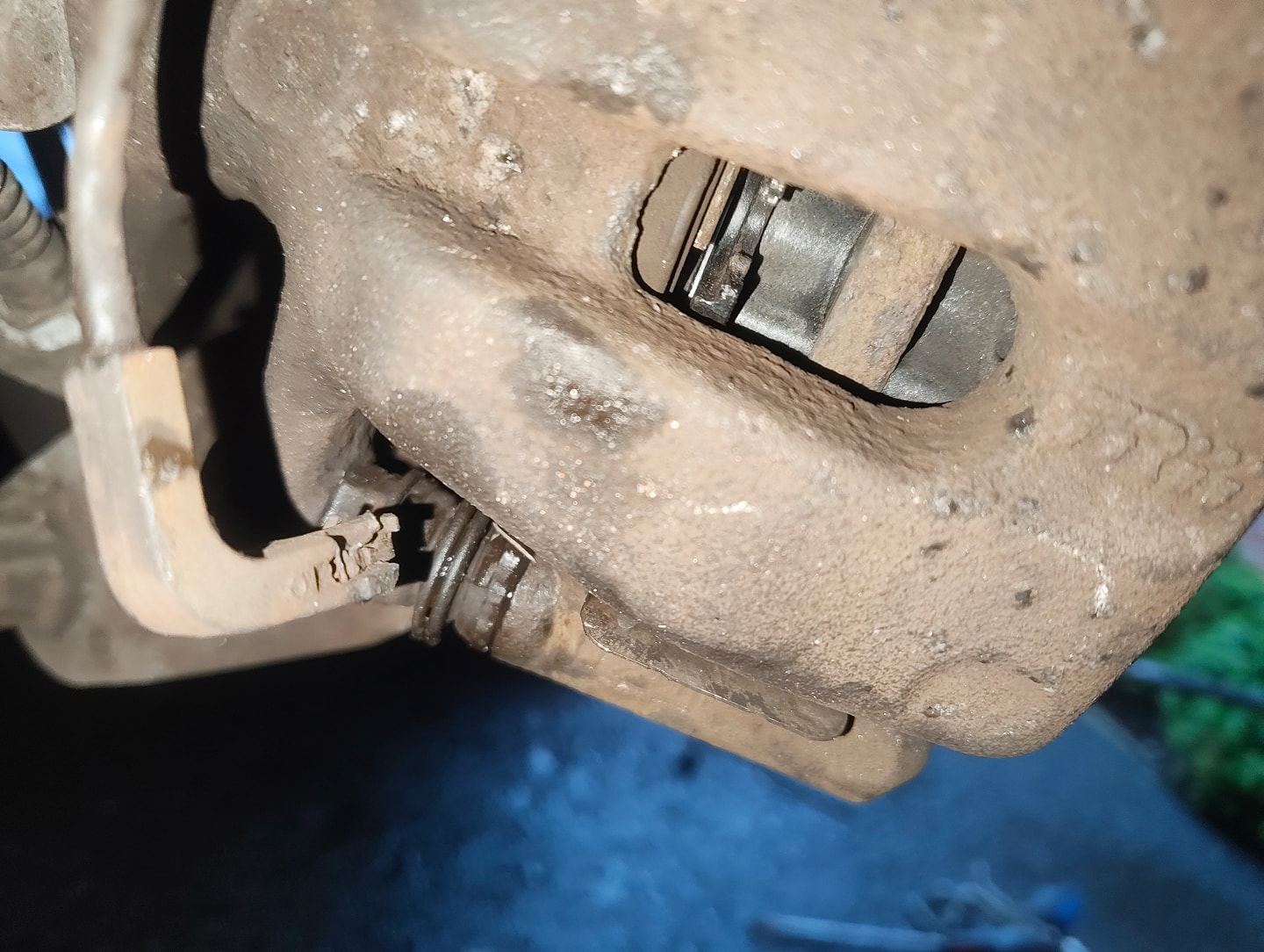 Rear brake caliper with sensor disconnected