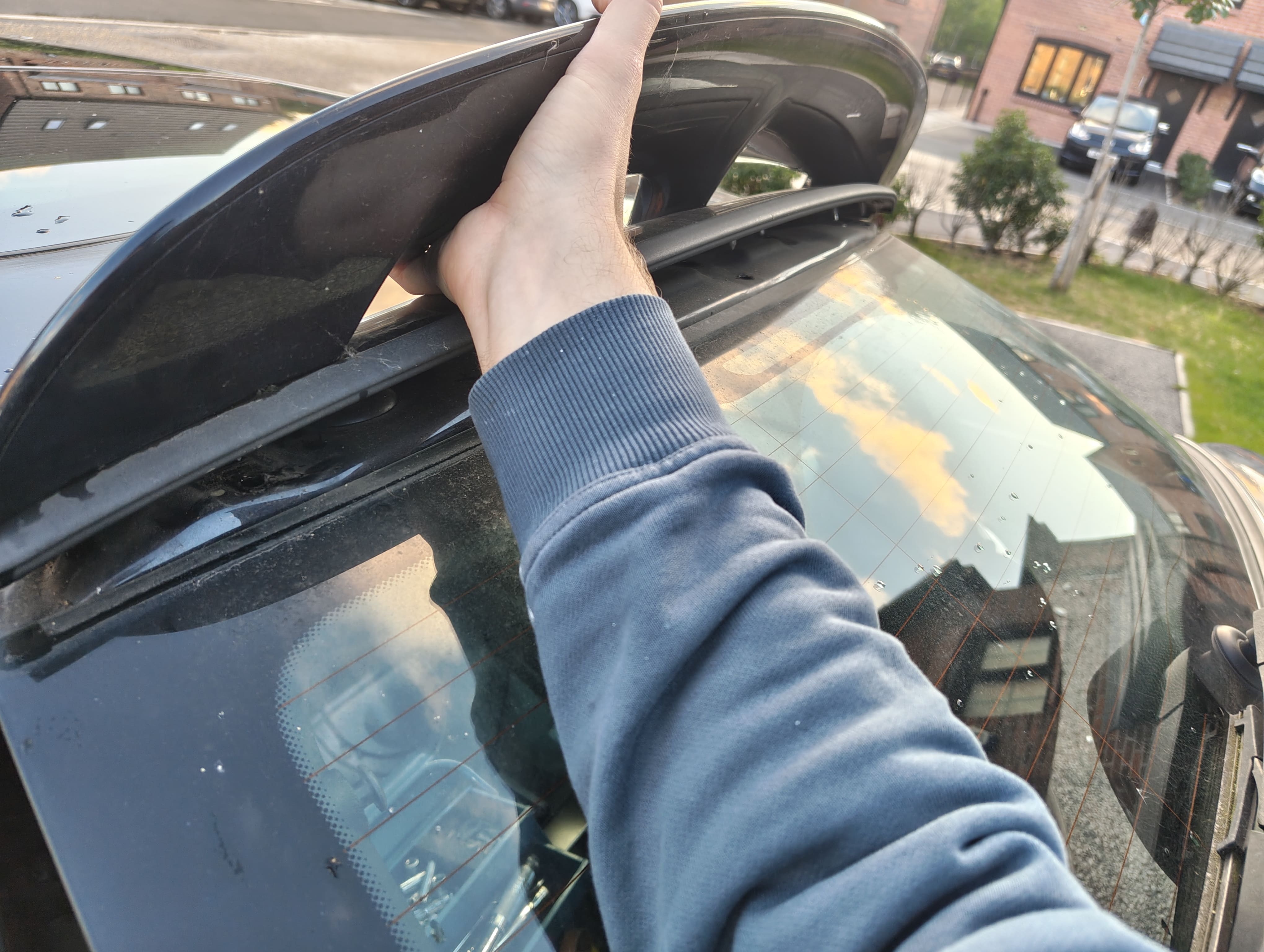Pulling spoiler by hand to remove